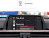 Movyro wireless Apple CarPlay retrofit device for BMW, compatible with Android Auto, showing the compact decoding box in the image.